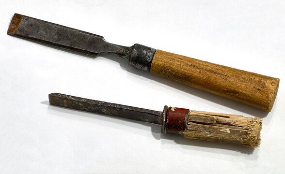 Two old chisels on a white background. Woodworking tool.