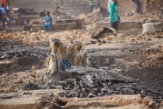 Kano, Nigeria - 27 January 2024: View of the charred remains and ash-covered ground at Dakata fire service Fatima market, a stark testament to the destructive power of fire.