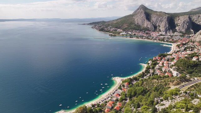 Drone aerial capturing vast open Adriatic Sea near Omis with endless blue horizon.