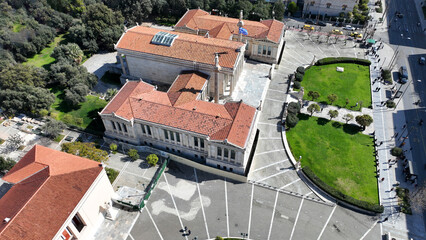 Obraz premium Aerial drone photo of historic Neoclassic building of Academy of Athens featuring statue of goddess Athena in Acadimias street, Attica, Greece