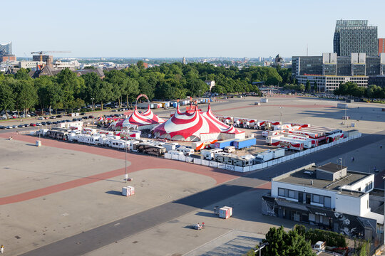 HAMBURG, GERMANY - 12. June 2025: Zirkus Charles Knie at the Heiligengeistfeld event location in the St. Pauli district. Big circus tent in white and red color. A lot of trucks are parking there.