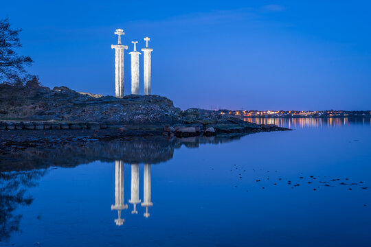 Sverd i Fjell Viking Swords Monument Reflected in Still Water at Blue Hour, Hafrsfjord, Stavanger, Rogaland, Norway - July 9 2018