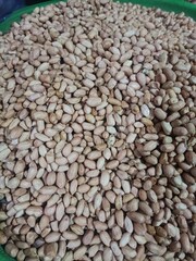 Fototapeta premium Organic Peanuts Pile in Market with Natural Background