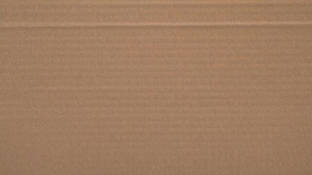 Brown corrugated cardboard texture background for shipping and packaging concepts