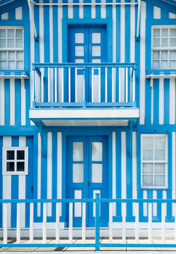 Europe, Portugal, Costa Nova.  Traditional candy-striped painted beach house (fomerly a fisherman's cottage) in the coastal town of Costa Nova.