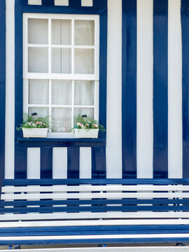 Europe, Portugal, Costa Nova.  Traditional candy-striped painted beach house (fomerly a fisherman's cottage) in the coastal town of Costa Nova.