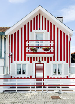 Europe, Portugal, Costa Nova.  Traditional candy-striped painted beach house (fomerly a fisherman's cottage) in the coastal town of Costa Nova.