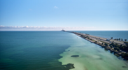 Aerial image of the highway leading up to the Sunshine Skyway Bridge over Tampa Bay linking Pinellas and Manatee County