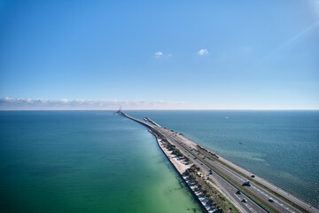 Aerial image of the highway leading up to the Sunshine Skyway Bridge over Tampa Bay linking Pinellas and Manatee County