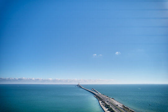 Aerial image of the highway leading up to the Sunshine Skyway Bridge over Tampa Bay linking Pinellas and Manatee County