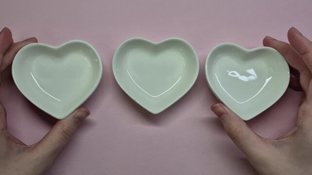 Serving three heart shape plates, small plates, boul for snacks, celebrating valentines day