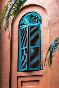 Discover the Charm of Southern Architecture: Elegant Blue Shutters on Stucco Wall, Georgia, Savanah, USA