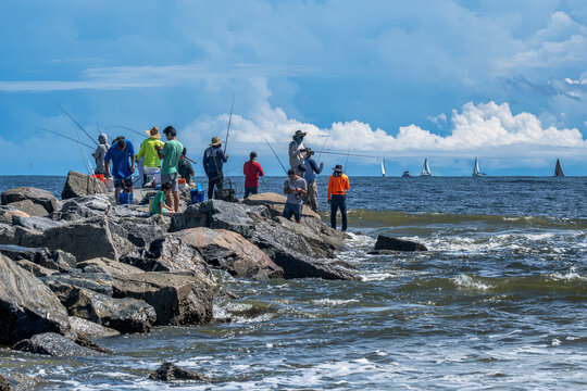 Enjoying a Day of Coastal Fishing and Sailing Adventures: Beachside Fun and Relaxation in Florida, New Smyrna Beach, USA