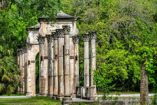 Ancient Stone Columns Amidst Lush Greenery: Discover Historic Calle Grande in Florida, Ormond Beach,USA
