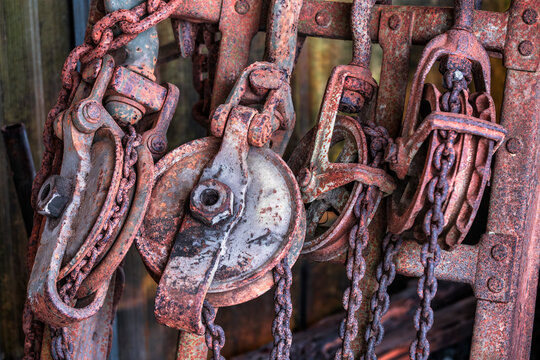 Explore Rustic Charm with Vintage Rusted Pulleys and Chains &ndash; A Perfect Touch for Industrial Decor Enthusiasts