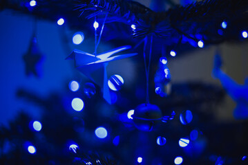 blue Christmas lights white origami baubles