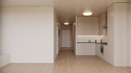 Obraz premium A modern kitchen with white cabinets and light wood floors in an empty apartment