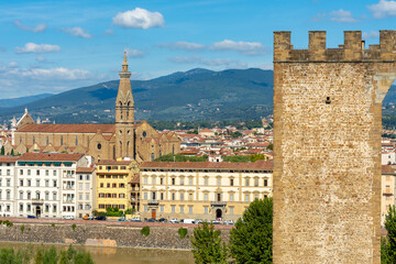 Fototapeta premium Tower of San Niccolo and Basilica of the Holy Cross (Santa Croce) in Florence, Italy