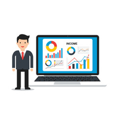Businessman Standing Next to Laptop Displaying Financial Income Charts and Graphs