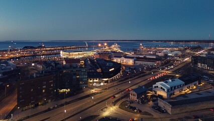 Obraz premium Drone View of Tallinn Harbor and Modern Cityscape at Dusk
