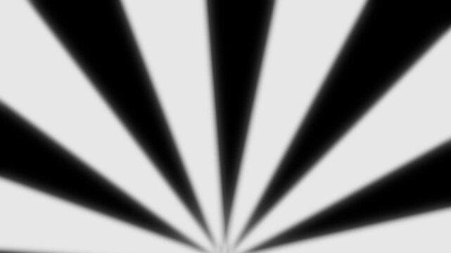 White spotlight rays animation rising from bottom horizon with radial light spread and rotating motion on black background. 4K animated light rays background for opening, overlay, and motion graphics.