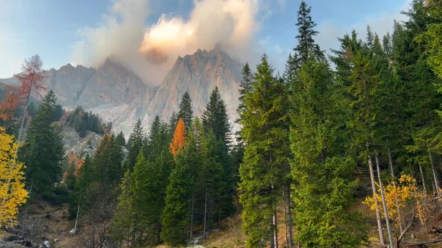 Panoramic view of high mountain peak with clouds in Dolomites, Italy