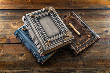 vintage leather books on the wooden table 