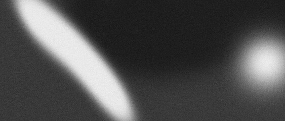 Grainy astronomical image showing a bright elongated light streak and a circular glowing object against a dark textured space background © rahul09