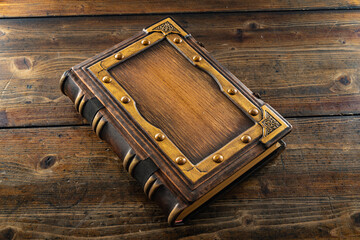 vintage leather book on the table with blank central part of the cover