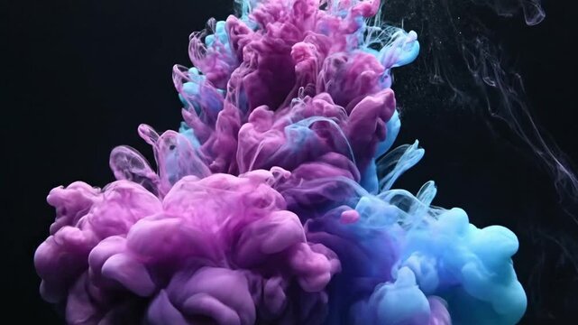 Colorful smoke swirls in dark water creating vivid patterns and shapes during quiet moments in artistic exploration