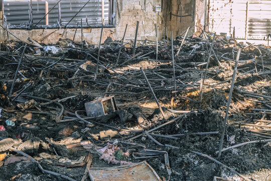 Burnt metal shelves of a store devastated by fire