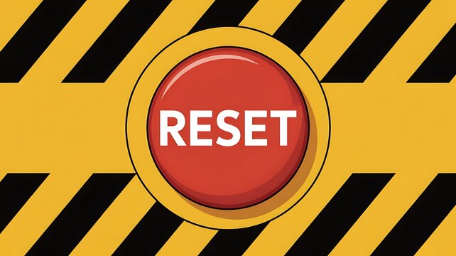 Red reset button on yellow and black striped background