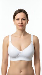 Fototapeta premium Young woman in a white sports bra posing in a studio, fitness lifestyle, athletic body wellness, wellness concept, mammoplasty surgeon