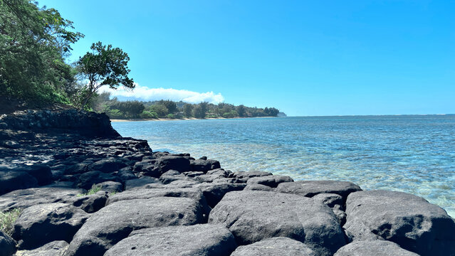 Ka Lae O Kowali, Anini beach with the views of Volcanic Rock formations and large coral reef located on the north shore of Kauai, Hawaii, United States