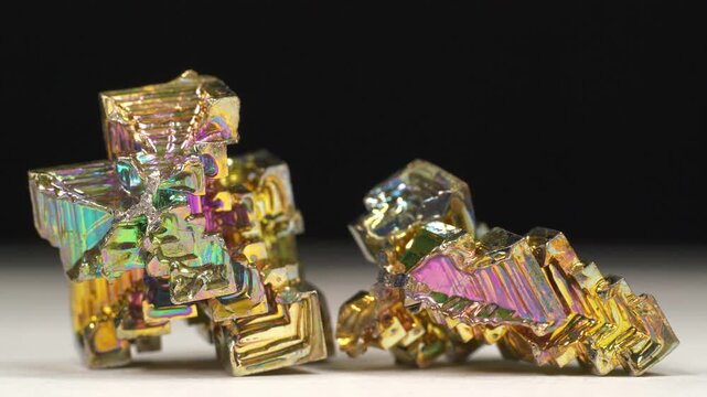 Bismuth crystals. Bismuth - chemical element with symbol Bi and atomic number 83. Post-transition metal and one of pnictogens. Synthesized bismuth crystal. Iridescent coloration is due to oxide film