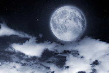 Fototapeta premium Big full moon among clouds in night sky