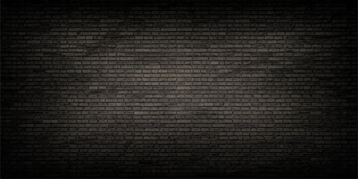 A detailed view of a dark charcoal gray brick wall with subtle lighting and a natural texture feel