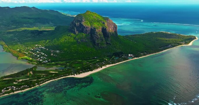Aerial view of Le Morne Peninsula, Le Morne Brabant Mountain. Sea lagoon formed by coral reefs, Mauritius Island, Africa, Indian Ocean. Underwater waterfall in Le Morne
