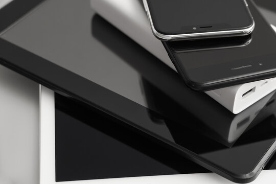 Stack of modern gadgets, closeup
