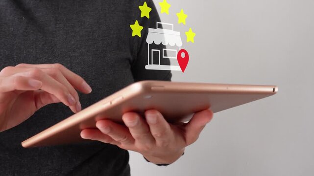 Price per zone. Close-up of a businesswoman interacting with her tablet. With an animation of a five-star rating from a local store.