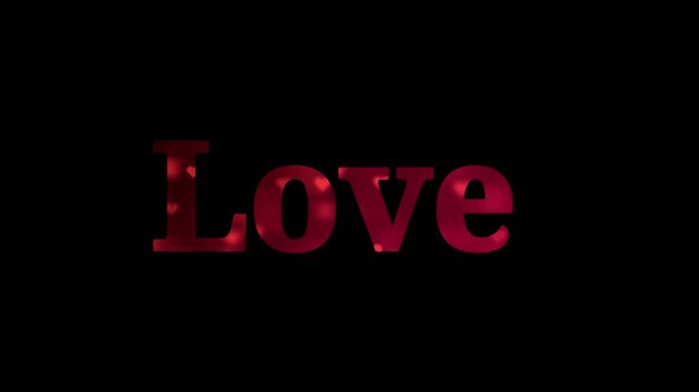 A video showcasing the word Love in a bold, red font on a black background