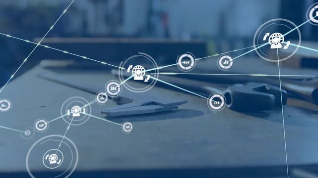 Vertical video: HUD pulsing, initiating expanding network overlaying workbench tools for analytics
