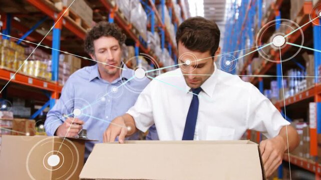 Warehouse packer opening box and inspecting while supervisor noting clipboard, nodes rising