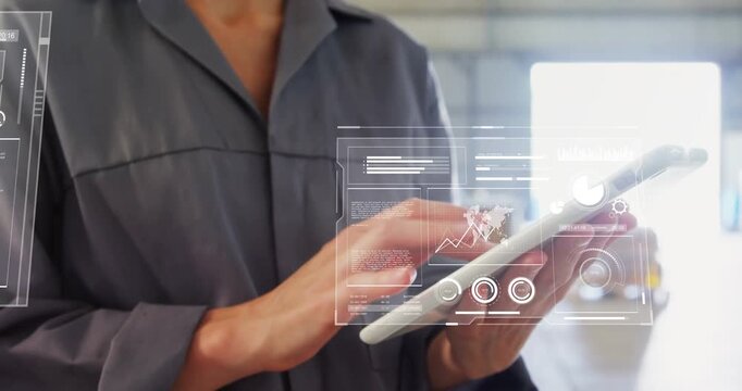 Female tech tapping tablet in warehouse, overlaying AR dashboards and swiping charts for audit