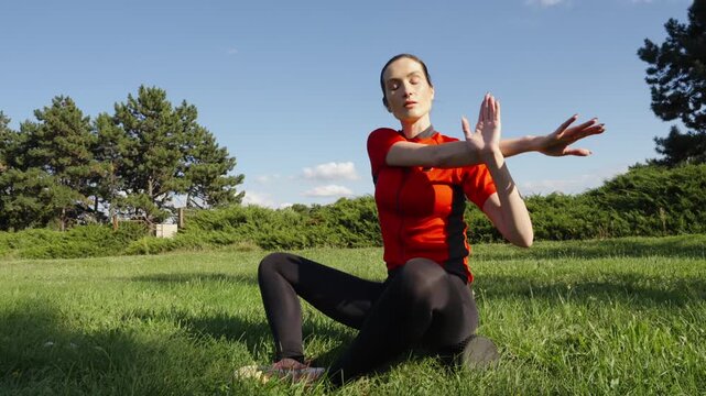Stretching exercises in a sunny park