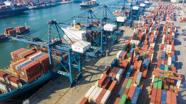 Cargo container port harbor dock shipping yard freight terminal hub under blue sky panorama view with global commerce activity