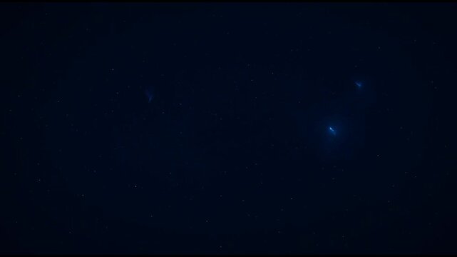 A dark night sky with a few bright blue stars shining brightly