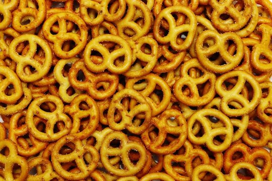 Heap of pretzel biscuit snack texture background