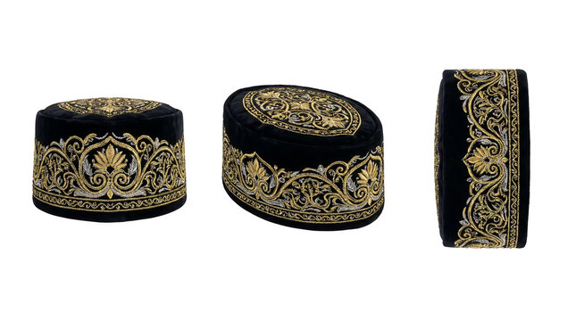 Traditional gold-embroidered velvet tubeteika skullcap from Bukhara, Uzbekistan, isolated on white background.