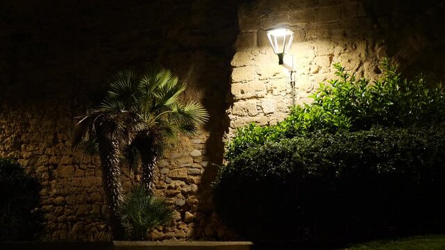 The walls of the Sant Pere bastion on a dark and windy winter night. Palma de Mallorca, Spain.